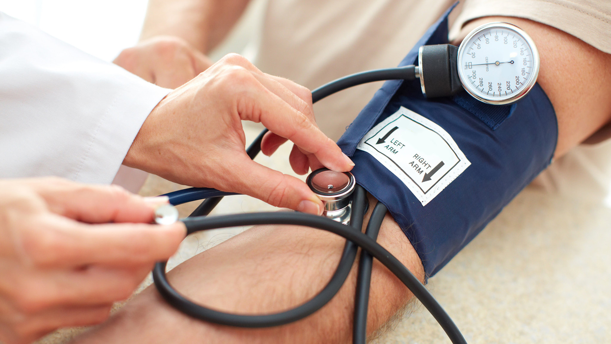 man having his blood pressure checked