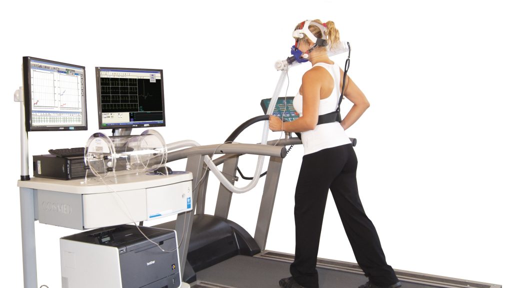 woman on treadmill with cardiopulmonary face mask on