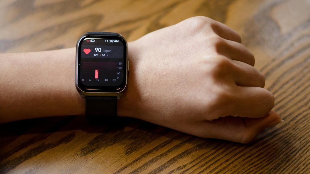 arm with fitness smartwatch around wrist